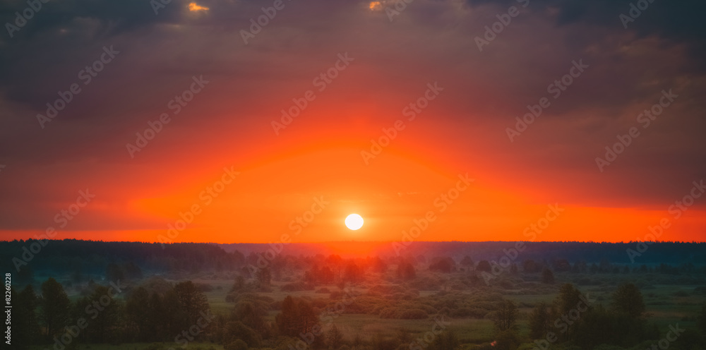 Beautiful Forest On Sunrise. Dramatic Sky With Sunrise Sun Over Beautiful Forest On Sunrise. Dramatic Sky With Sunrise Sun Over