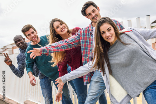 Group of friends having fun together outdoors