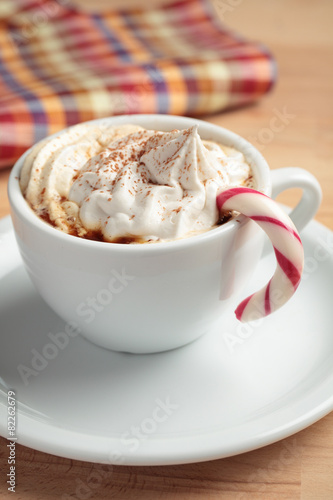Coffee with whipped cream and candy cane
