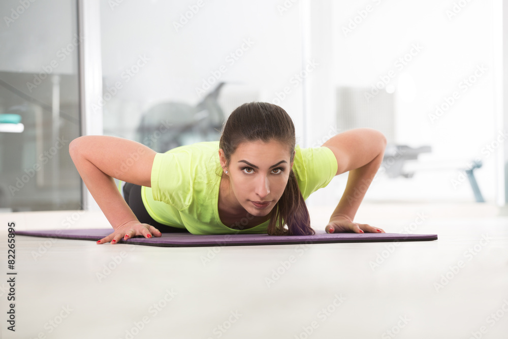 Fototapeta premium Beautiful sporty woman in gym