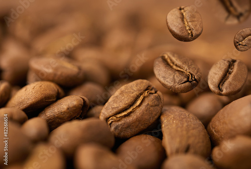 Closeup of coffee beans with focus on one