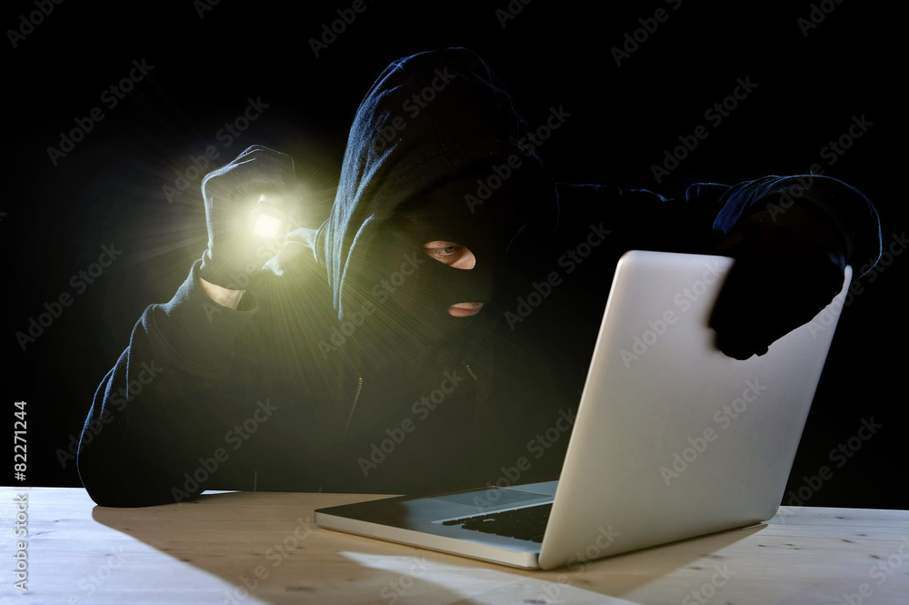 hacker with computer laptop holding flashlight hacking system Stock Photo |  Adobe Stock