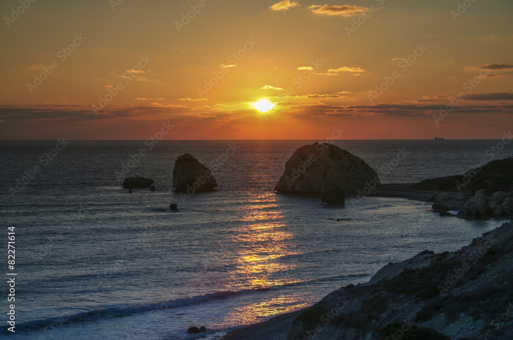 Romantic sunset at rocky beach at Cyprus