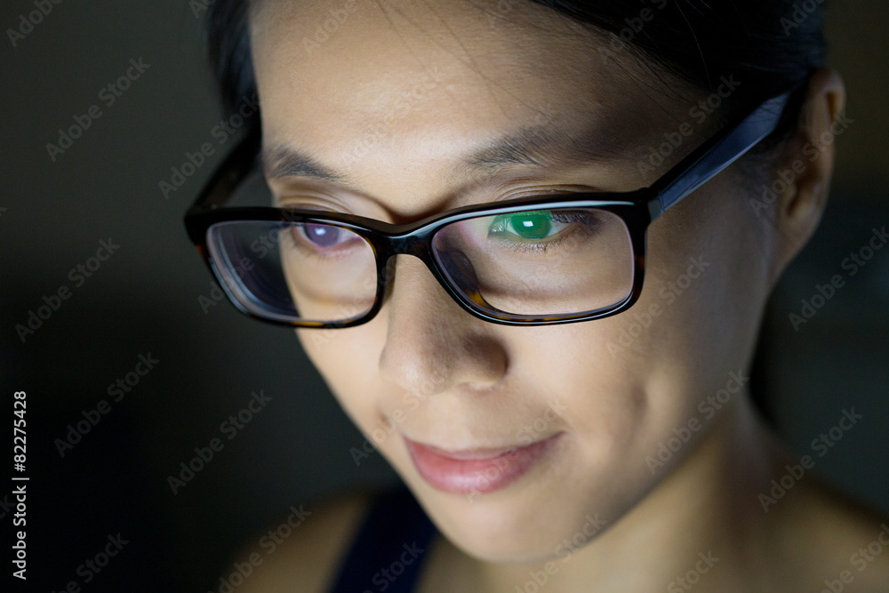 Young woman using notebook computer at night Young woman using notebook computer at night