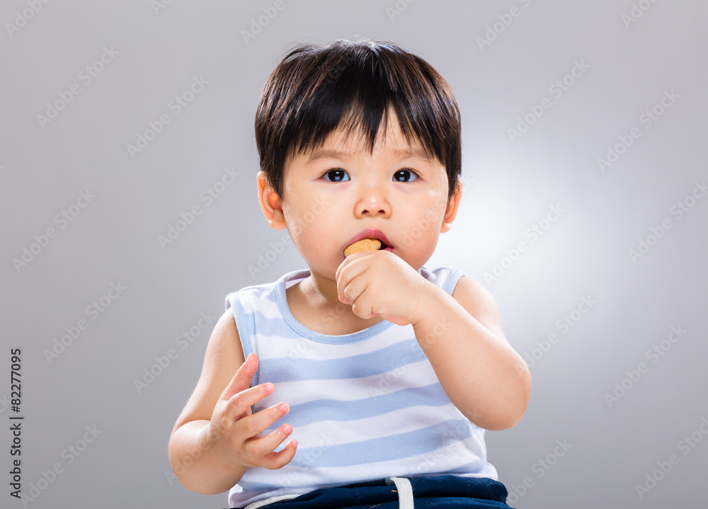 Baby boy enjoy eating finger food Baby boy enjoy eating finger food