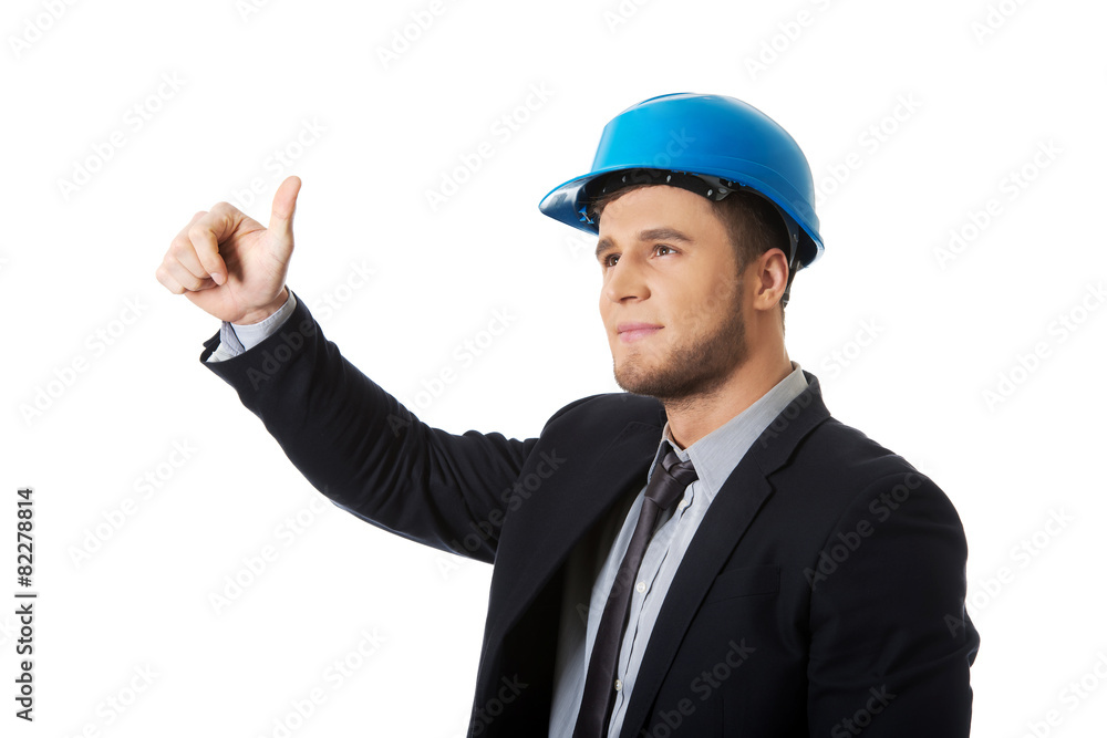 Happy businessman in helmet whit thumbs up. Happy businessman in helmet whit thumbs up.