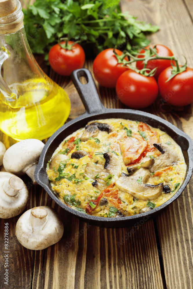 Omelet with mushrooms and tomatoes. Frittata Omelet with mushrooms and tomatoes. Frittata