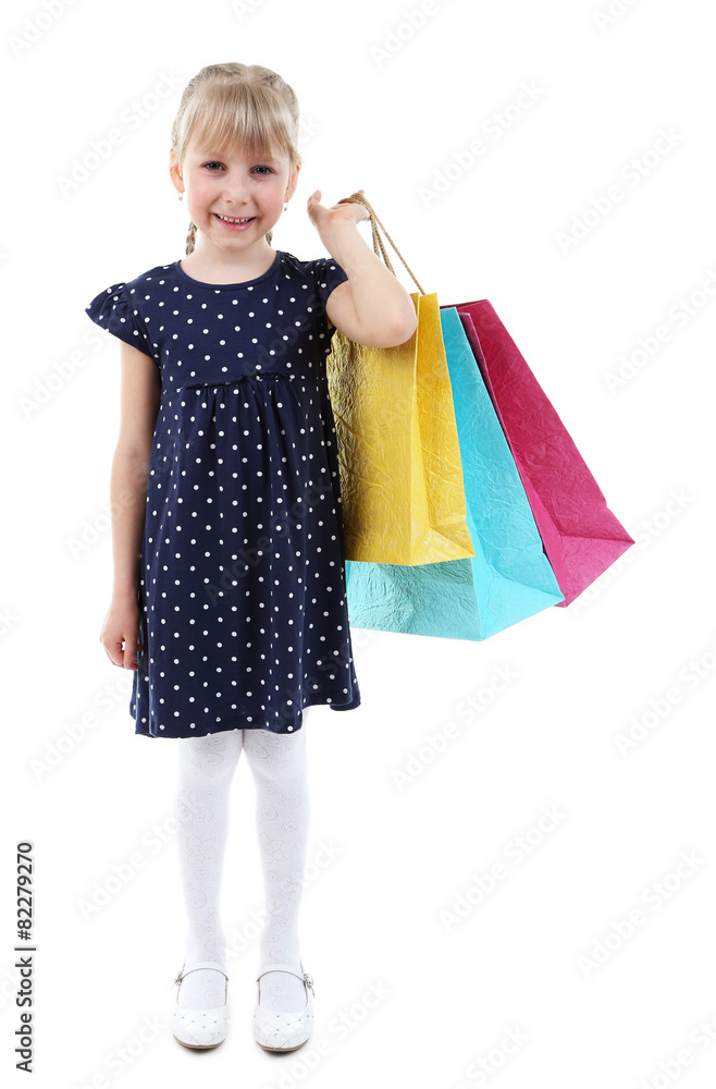 Beautiful little girl with shopping bags isolated on white Beautiful little girl with shopping bags isolated on white