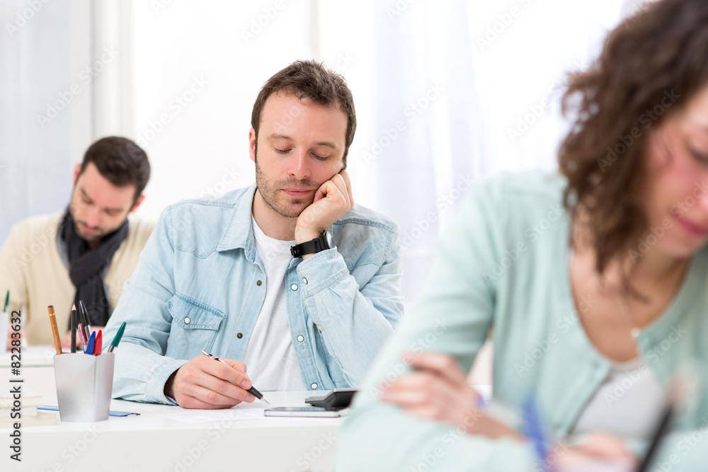 Young attractive man taking exams Young attractive man taking exams