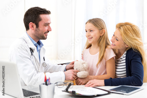 Little girl at the doctor with her mother