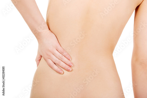 Woman with backache from behind