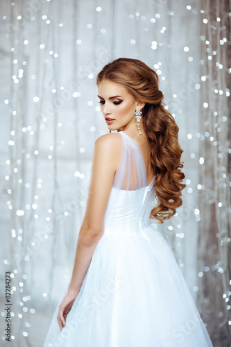 Portrait of Beautiful Bride in Lights. Fashion Dress and MakeUp