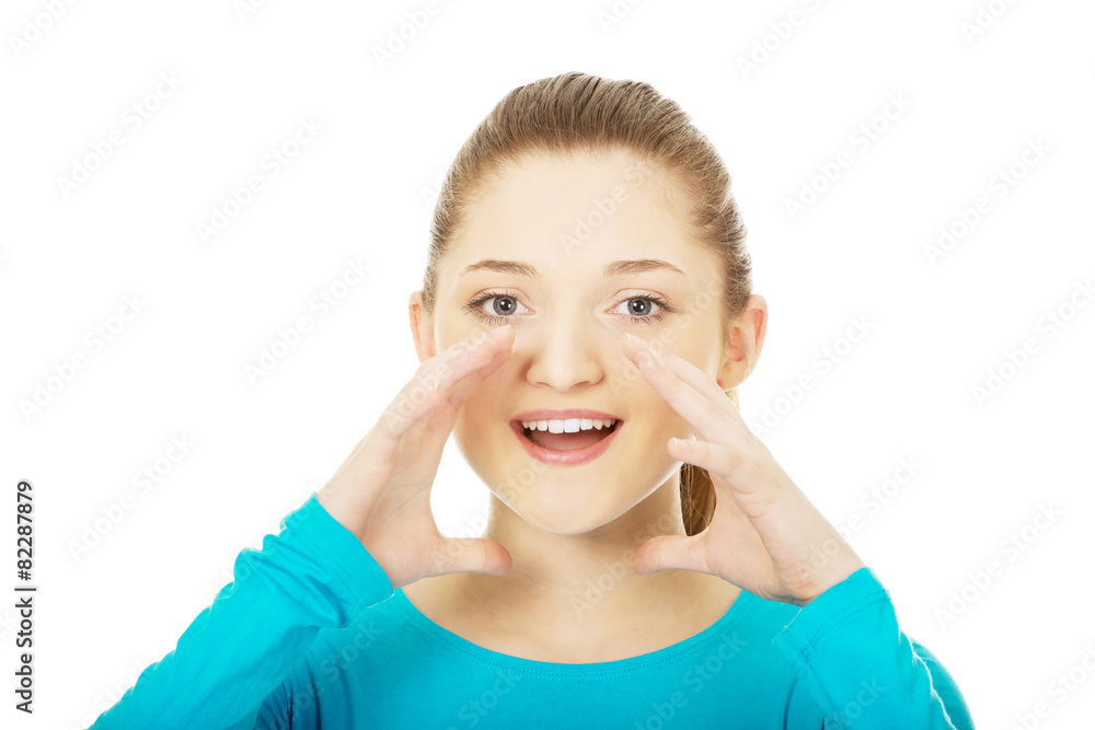 Young woman whispering a gossip. Young woman whispering a gossip.