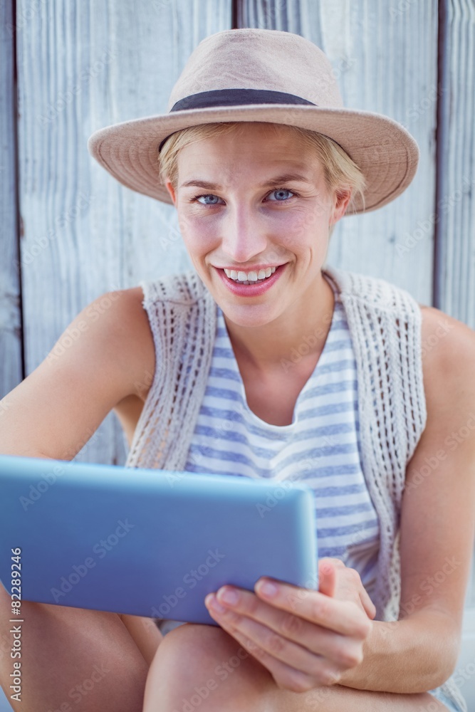 Pretty blonde woman using her tablet