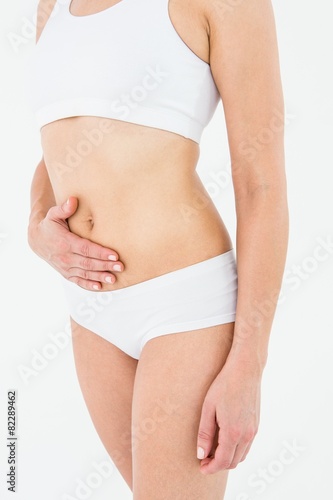 Fit woman suffering from stomach pain