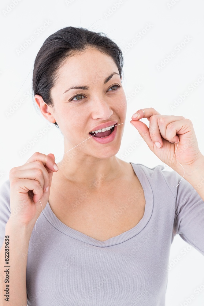 Woman using dental floss Woman using dental floss