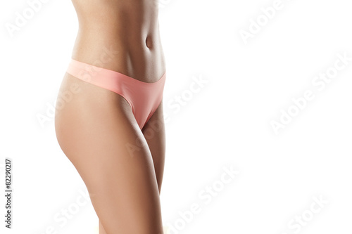 naked woman belly and pink panties on a white background