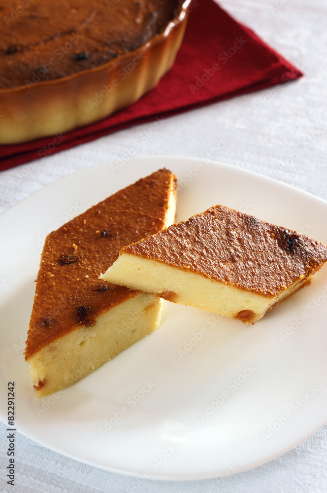 Two slices of cheesecake with raisins Two slices of cheesecake with raisins