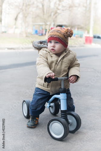 little boy riding runbike