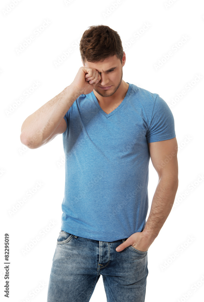 Young man crying.
