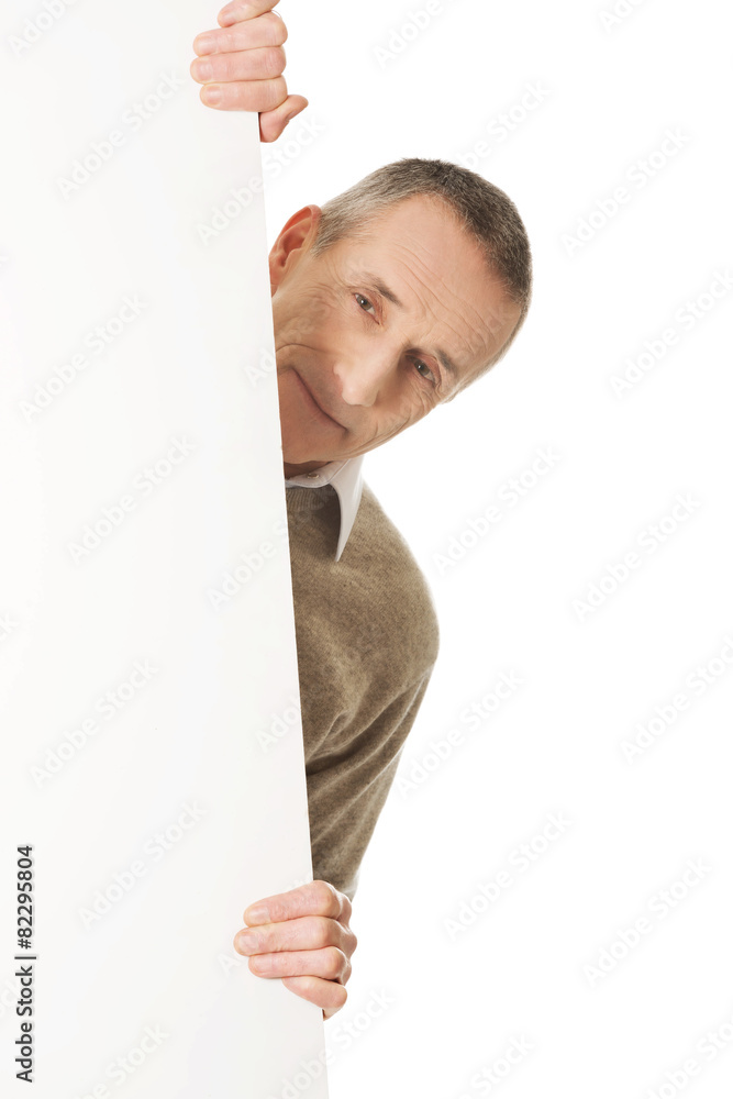 Mature man holding empty banner Mature man holding empty banner