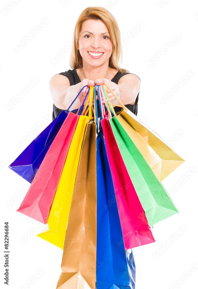 Happy shopping woman holding shopping bags