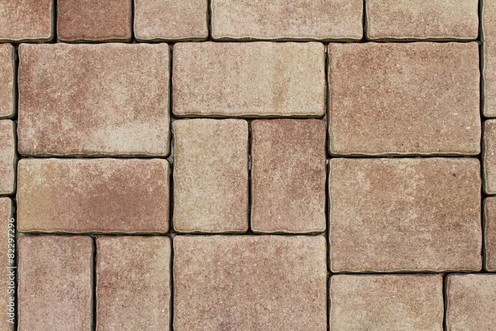 Detail of a concrete pavement with tiles Detail of a concrete pavement with tiles