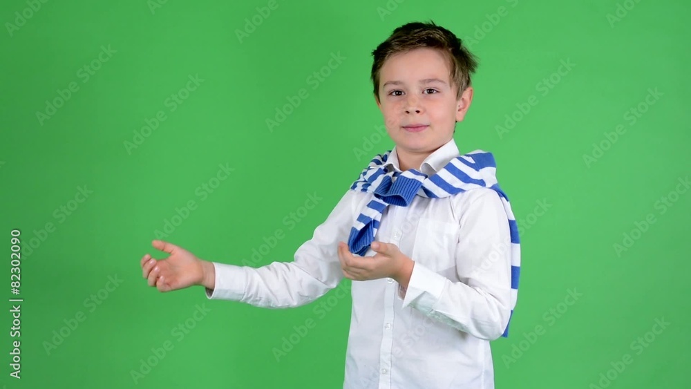 child boy introduces (with hands) - green screen - studio child boy introduces (with hands) - green screen - studio