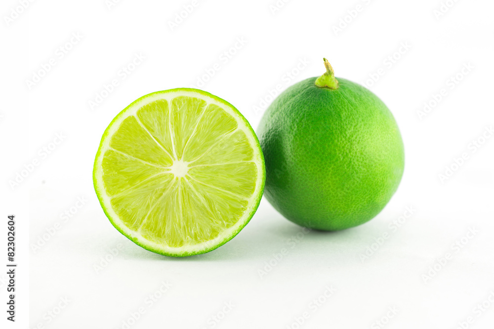 Half of Fresh lime citrus fruit on white background