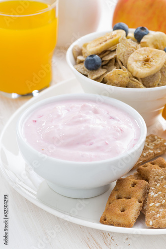 healthy breakfast - yogurt, cereal and juice, close-up