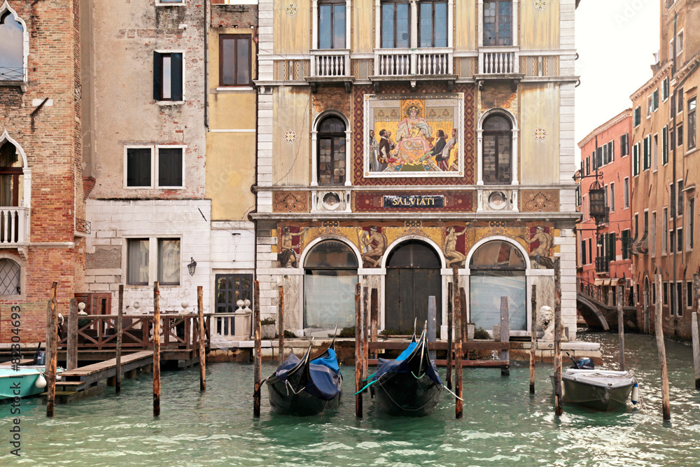 old venetian houses and gondola on Grand Canal, Venice, Italy