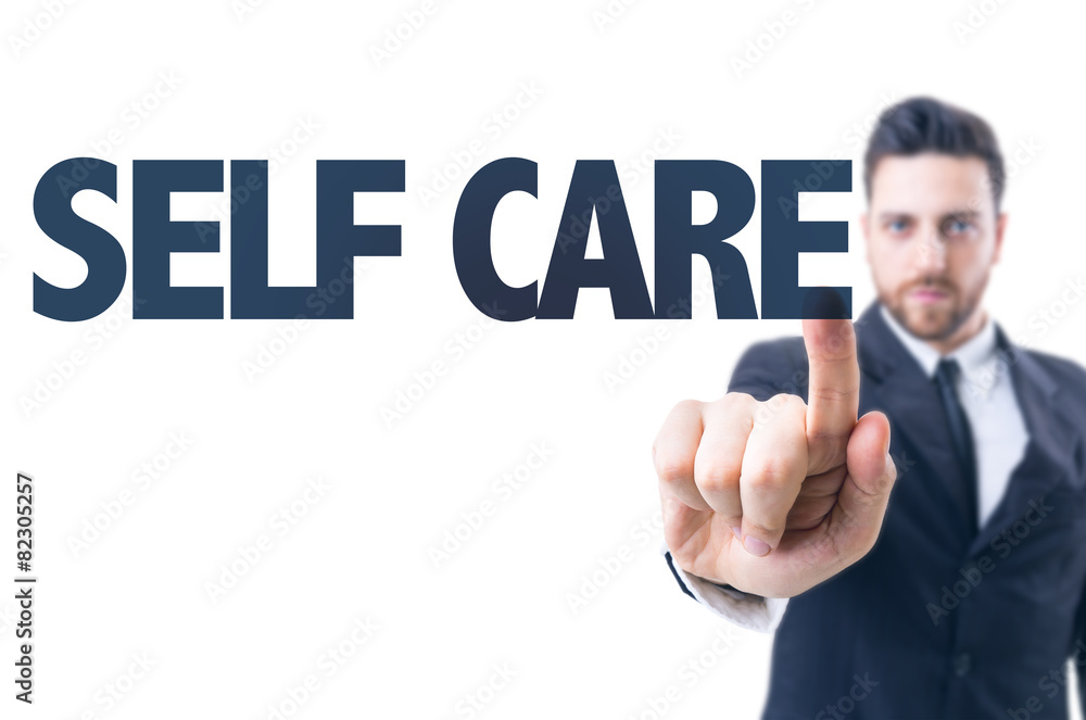 Business man pointing the text: Self Care Business man pointing the text: Self Care