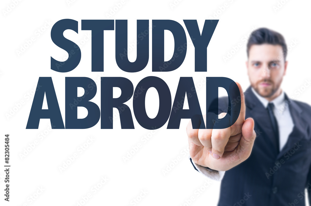 Business man pointing the text: Study Abroad Business man pointing the text: Study Abroad
