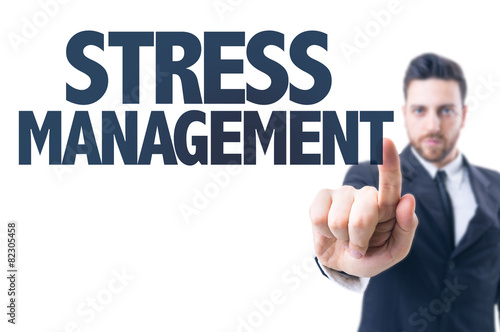 Business man pointing the text: Stress Management