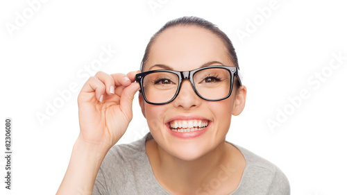 asian woman adjusting eyeglasses