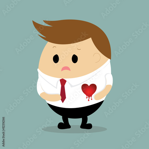 Sad Businessman with heart bleeding concept heartbreak
