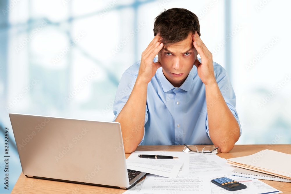 Debt. Man calculating his bills Debt. Man calculating his bills