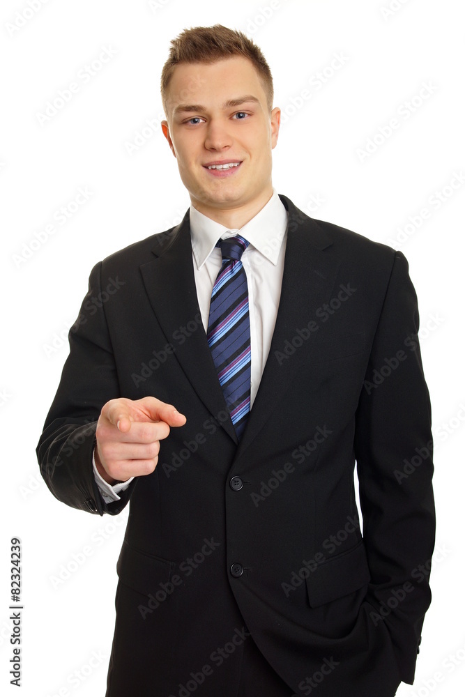 Young smiling businessman in suit shows on you Young smiling businessman in suit shows on you