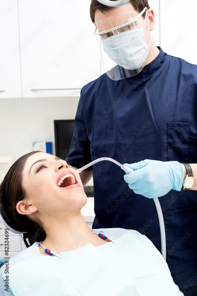Fototapeta premium Dentist examine on a female patient