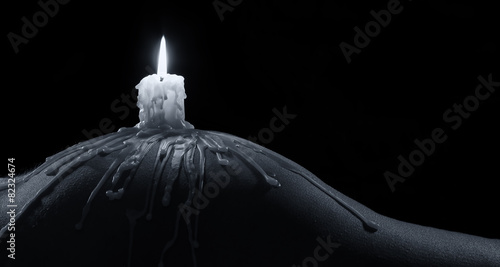 Photos Body scape of woman with burning candle and on her buttock artis