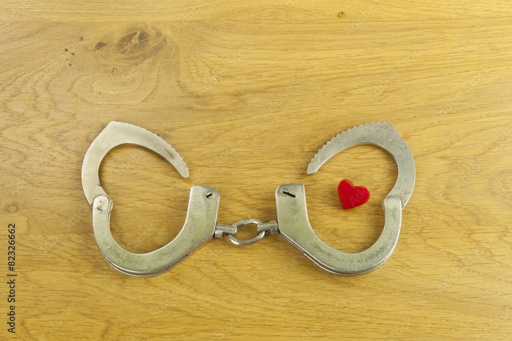 Heart bound by love, police handcuffs and heart Heart bound by love, police handcuffs and heart