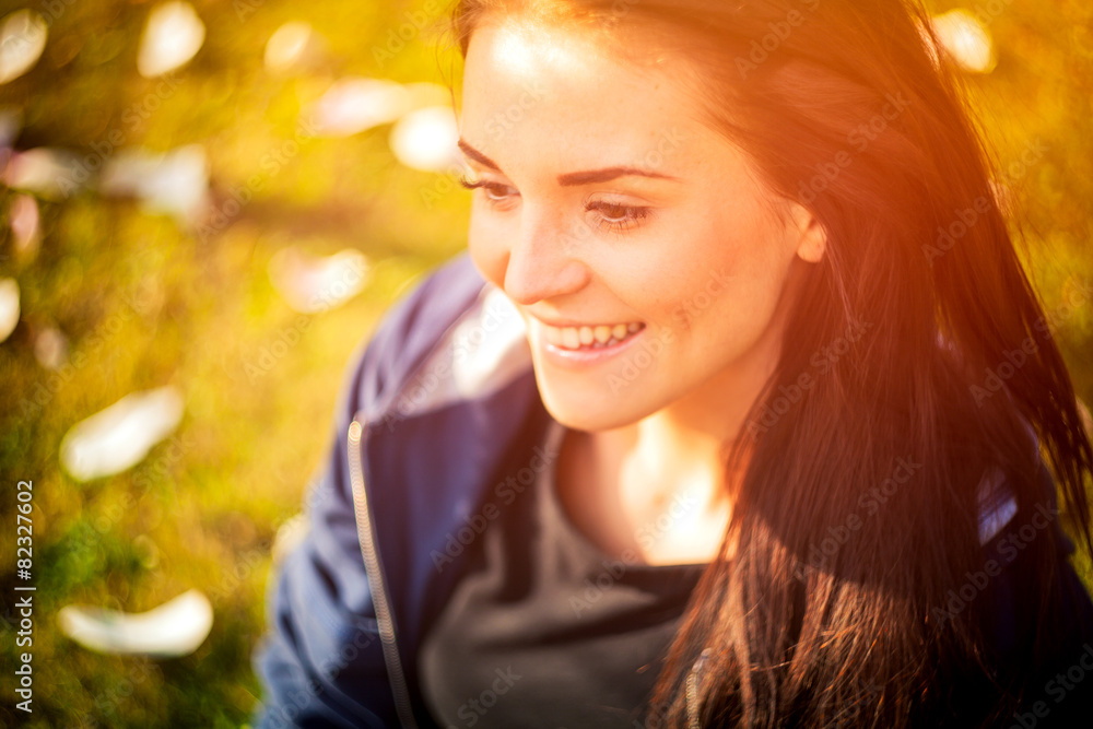 Beautiful girl on green summer grass, smiling and happy Beautiful girl on green summer grass, smiling and happy