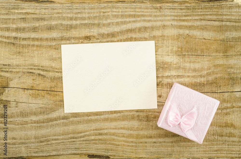 Empty card with heart on wooden table Empty card with heart on wooden table