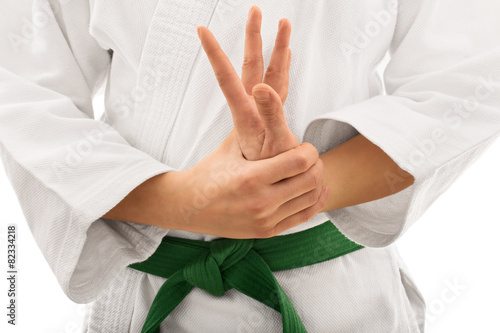 Young girl in kimono twisting her arm