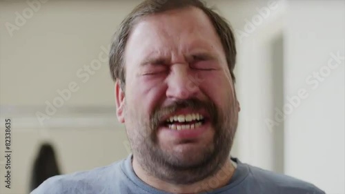 Close up shot of bearded man talking and crying / Orem, Utah, United States, 