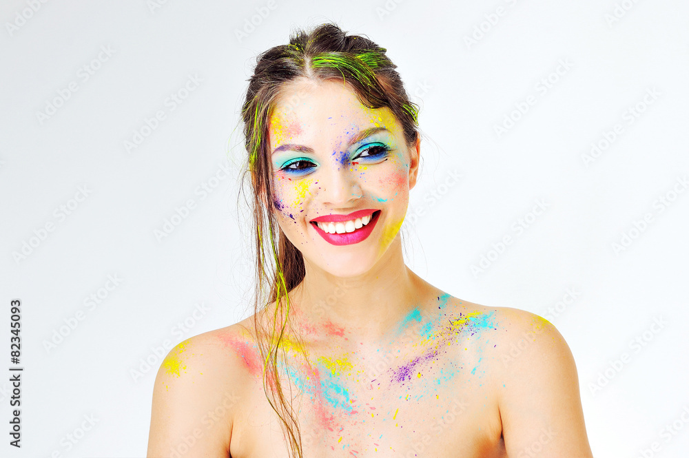 Woman face with spray paint on a white background