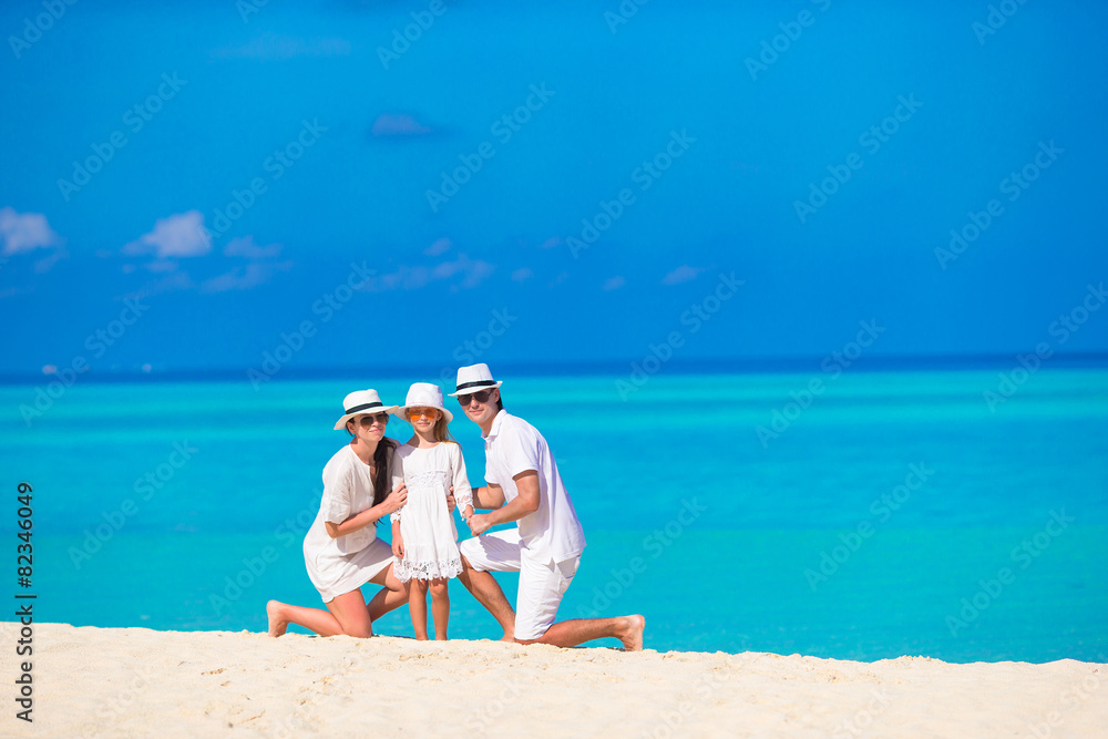 Happy family on white beach