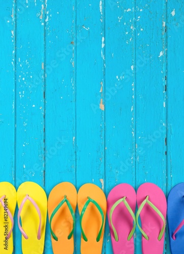 Summer. Flip flops with blue decking