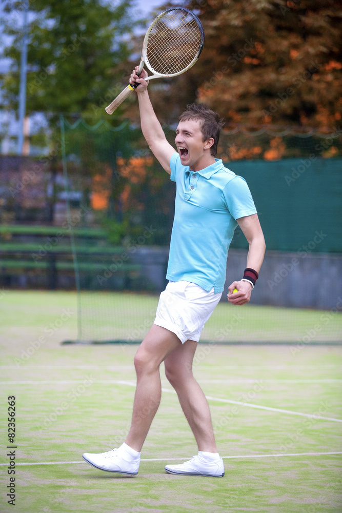Tennis Sport Concept: Portrait of young Exclaiming Male Caucasia