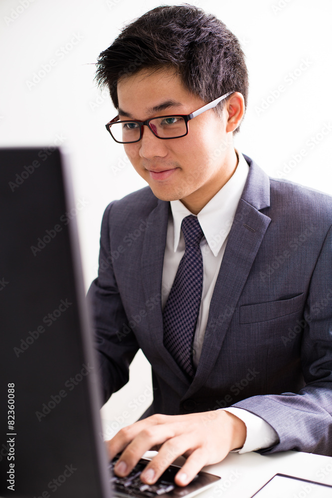 Handsome businessman working with laptop Handsome businessman working with laptop